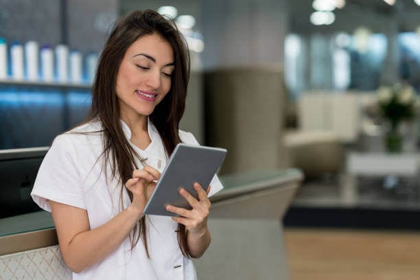 woman doing intake on ipad woman doing intake on ipad